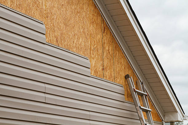 Professional Siding technician working in Farmingdale, NY